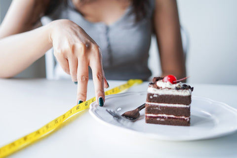 Ein Stück Torte und ein Maßband
