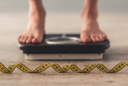 Progesteronmangel: Füße auf einer Waage